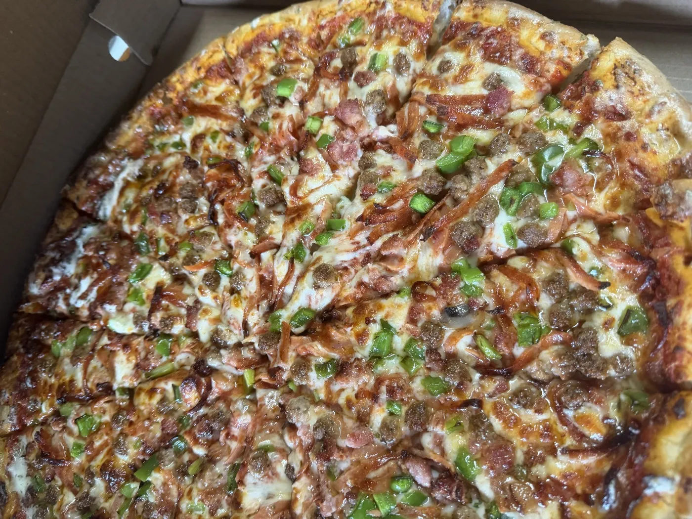 Meat Lover pizza with pepperoni, bacon, ham and sausage at Nikki's Pizza Windsor